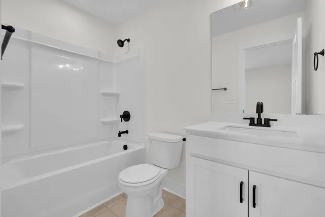 a sign board with a bench in a forest