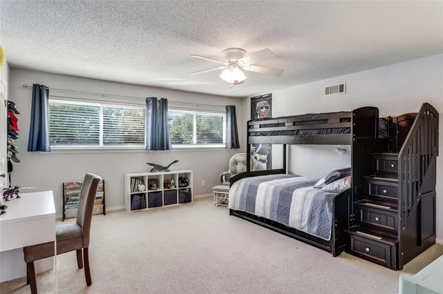 a bedroom with a bed and furniture