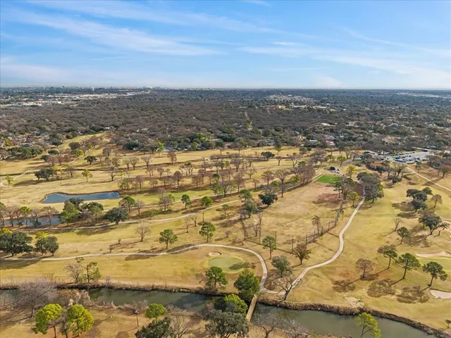 an aerial view of residential building and ocean