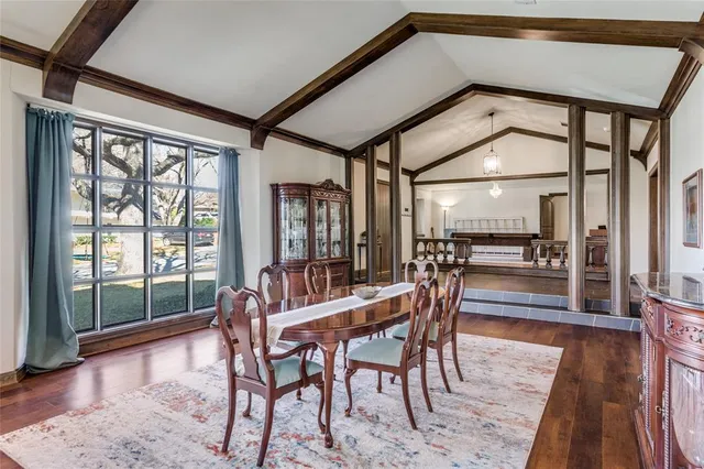 a dining room with furniture and wooden floor