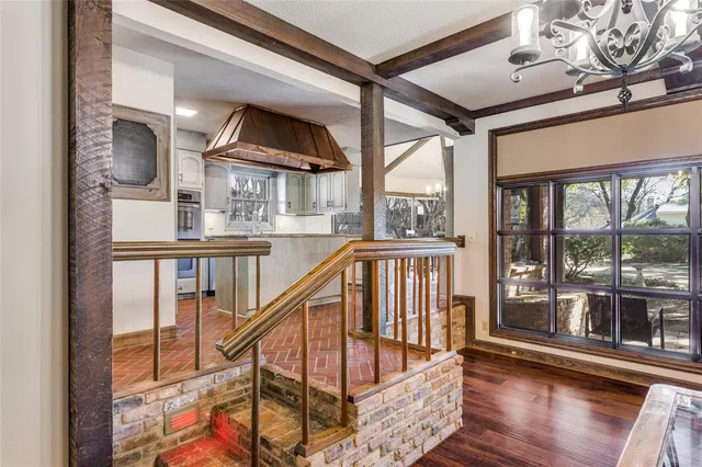 a view of staircase with furniture and floor to ceiling window