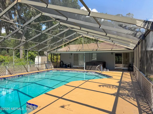 a view of swimming pool with a bench