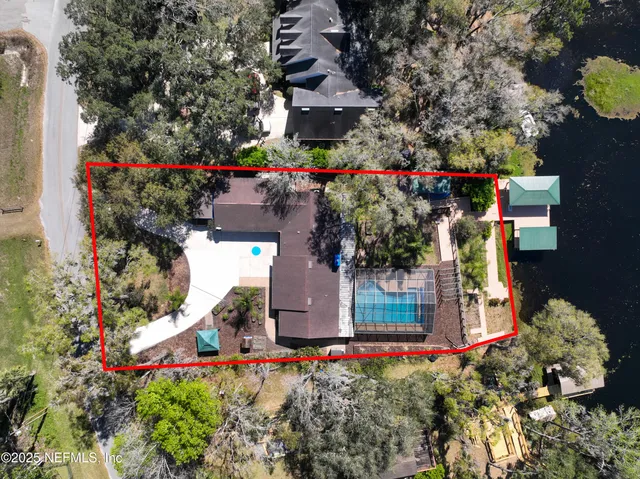 a view of a tennis room with wooden floor