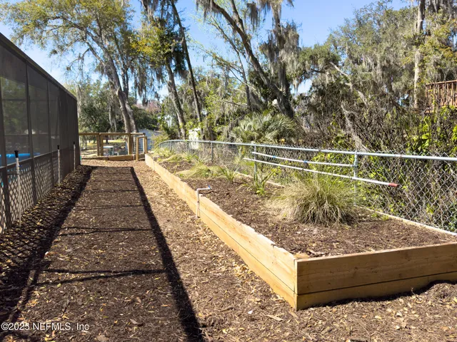 a backyard of a house with lots of green space