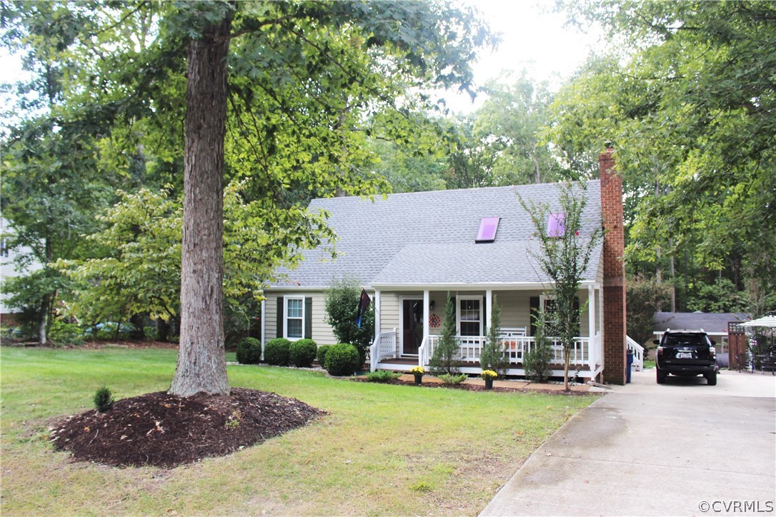 10340 North Donegal Road Chesterfield, VA 23832 - Photo 1 of 49 a front view of a house with swimming pool having outdoor seating