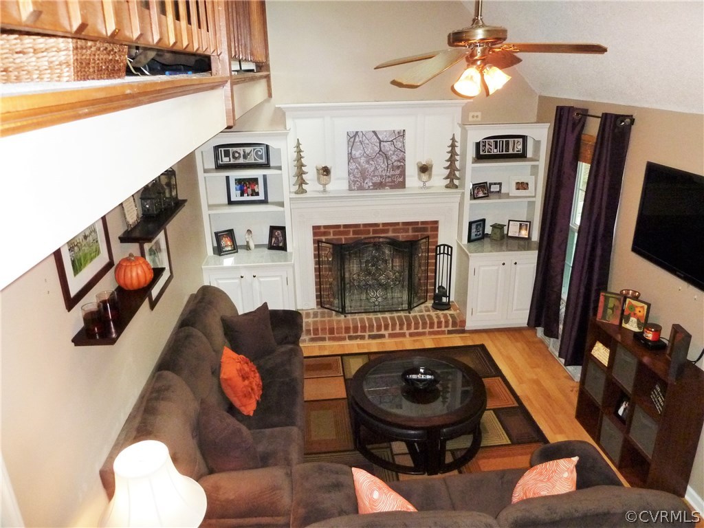 10340 North Donegal Road Chesterfield, VA 23832 - Photo 18 of 49 a living room with furniture and a flat screen tv