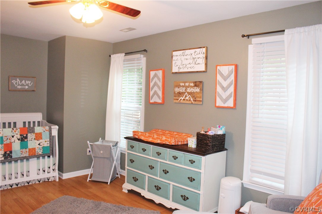 10340 North Donegal Road Chesterfield, VA 23832 - Photo 33 of 49 a bedroom with a bed and wooden floor