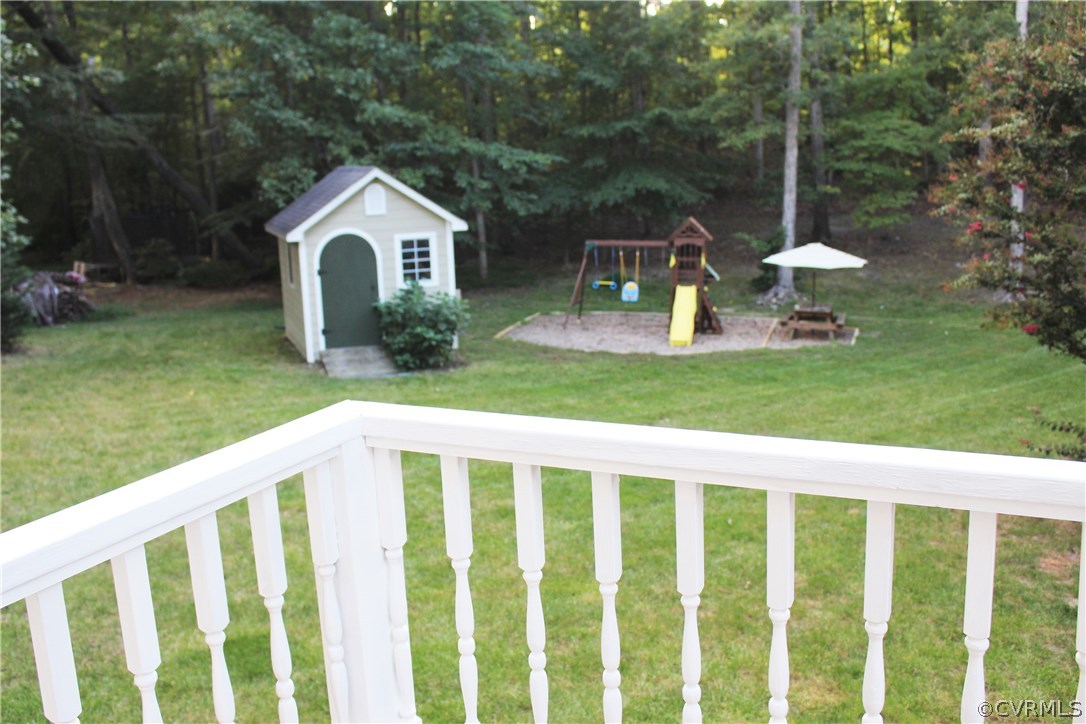 10340 North Donegal Road Chesterfield, VA 23832 - Photo 41 of 49 a view of a wooden house with a yard and fence