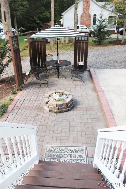 10340 North Donegal Road Chesterfield, VA 23832 - Photo 42 of 49 a view of a patio with table and chairs with wooden floor and fence