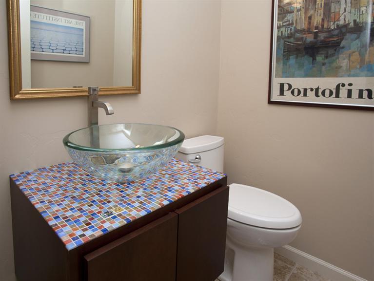 2570 Bald Mountain Road, Unit E Vail, CO 81657 - Photo 24 of 25 a bathroom with a toilet a sink and mirror