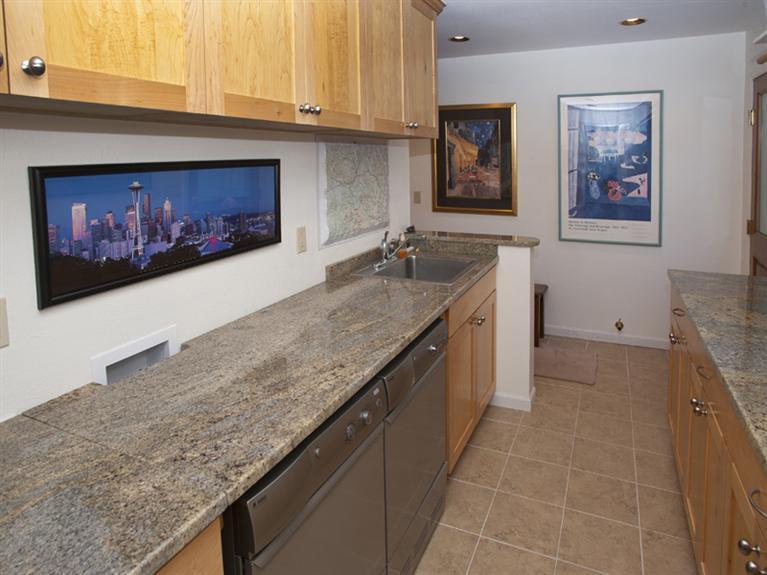 2570 Bald Mountain Road, Unit E Vail, CO 81657 - Photo 25 of 25 a kitchen with a stove and cabinets