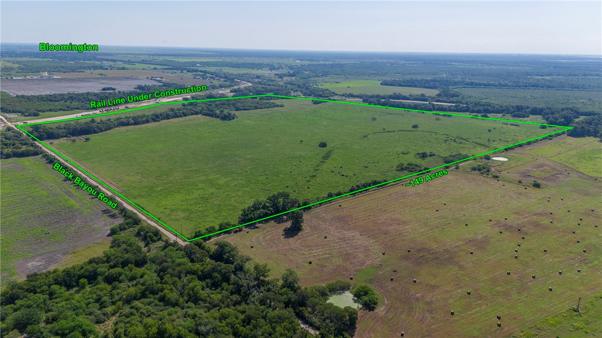 0 Black Bayou Road Bloomington, TX 77951 - Photo 5 of 39 a view of a green field with wooden fence
