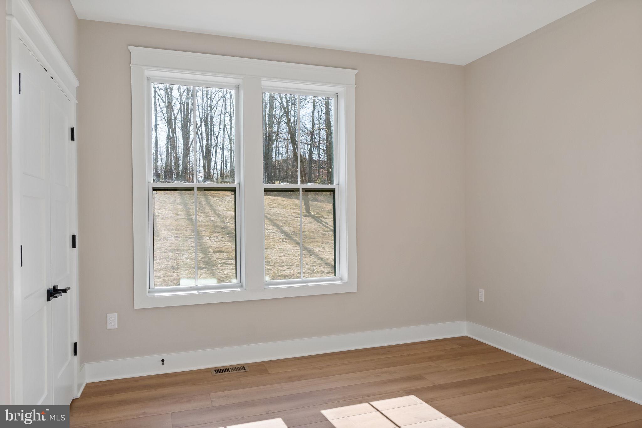 321 Mistletoe Lane Shepherdstown, WV 25443 - Photo 30 of 57 an empty room with wooden floor and windows