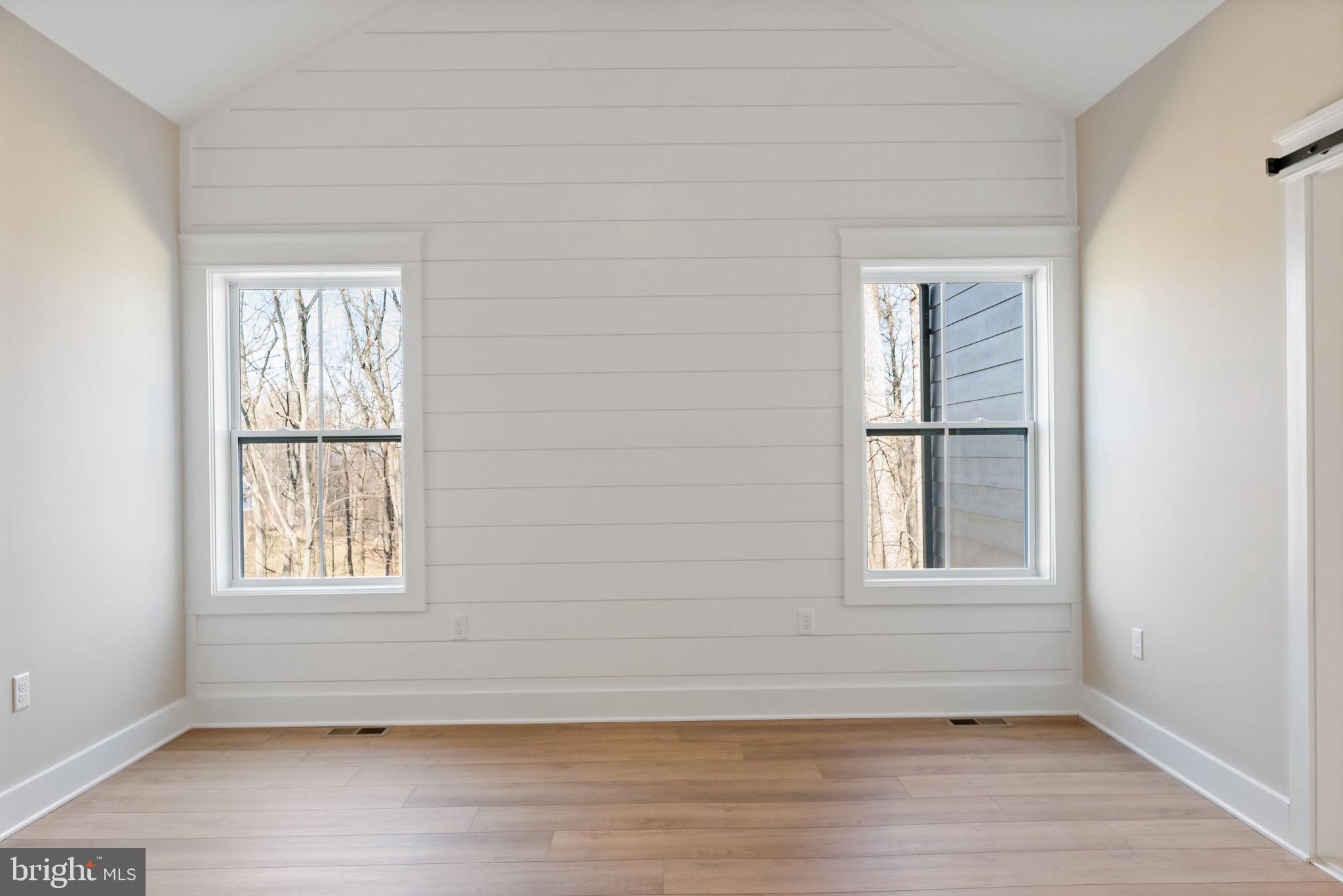 321 Mistletoe Lane Shepherdstown, WV 25443 - Photo 34 of 58 an empty room with wooden floor and windows