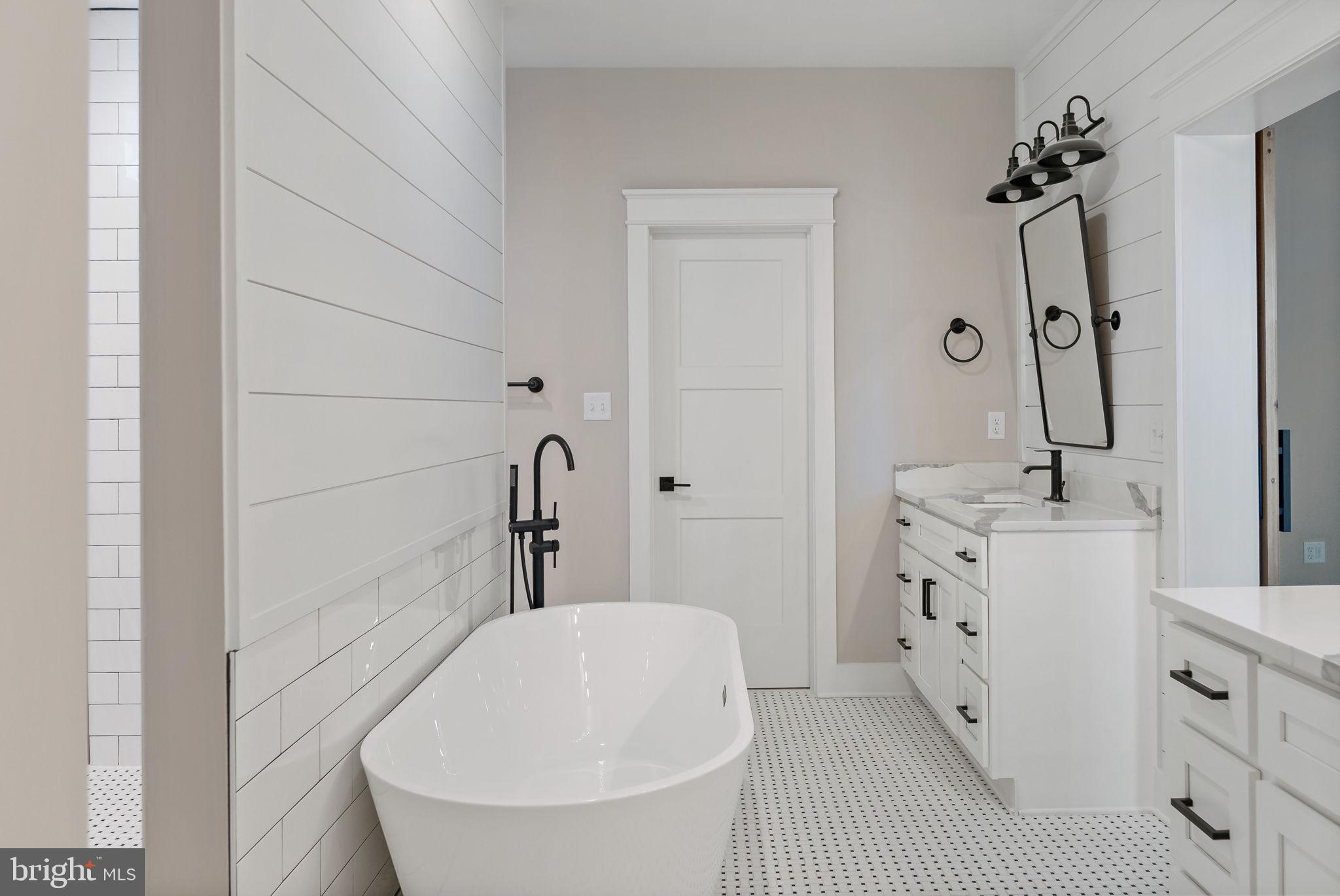 321 Mistletoe Lane Shepherdstown, WV 25443 - Photo 40 of 58 a bathroom with a tub sink and mirror