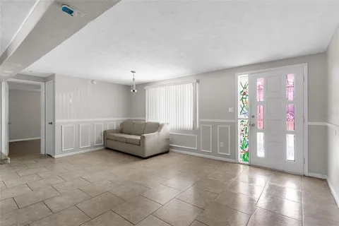 a living room with furniture and window