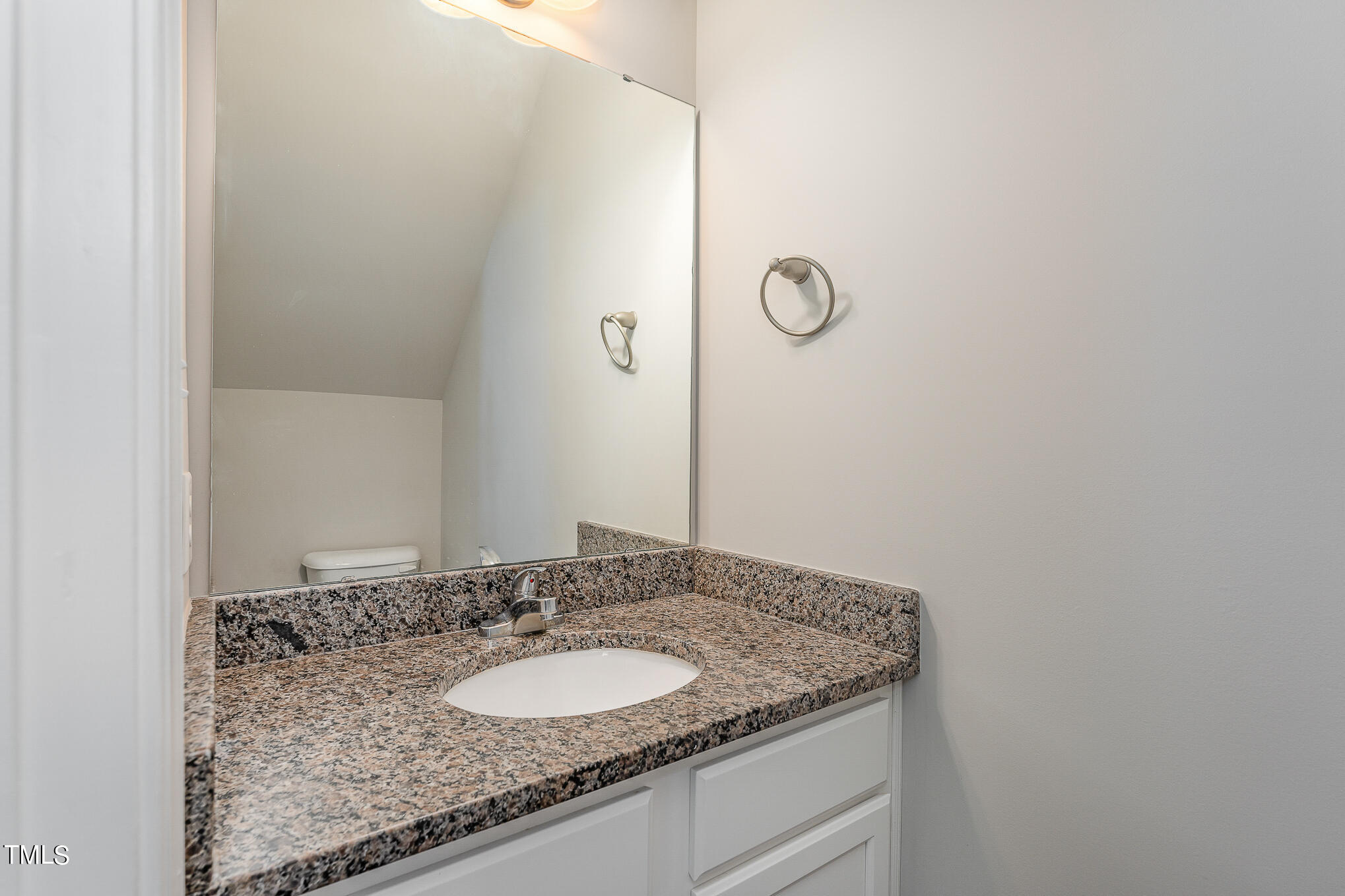 117 Celestial Drive Garner, NC 27529 - Photo 5 of 15 a bathroom with a granite countertop sink and a mirror