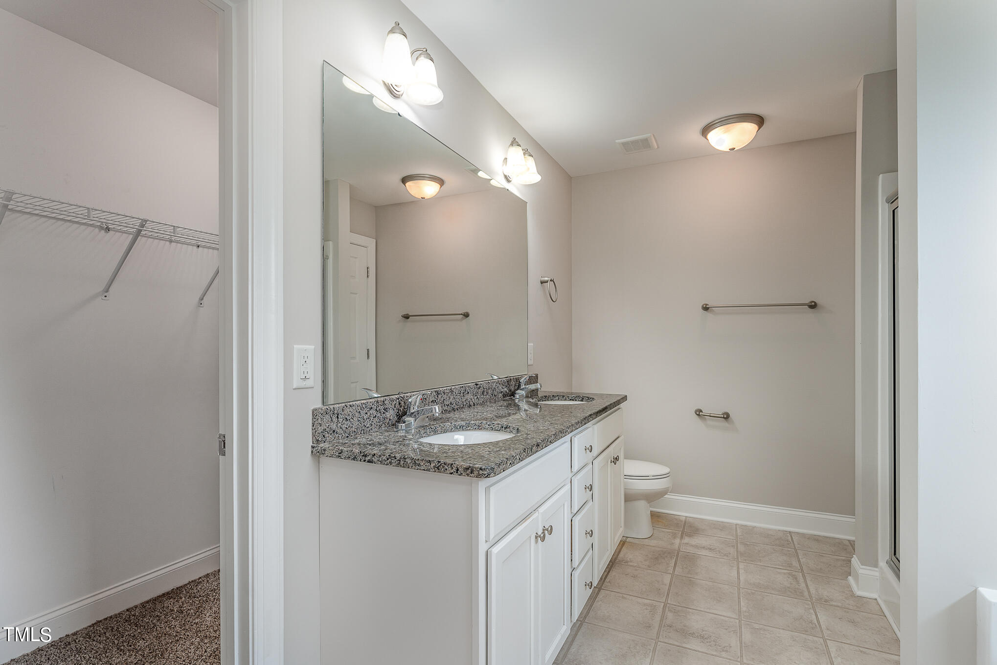 117 Celestial Drive Garner, NC 27529 - Photo 8 of 15 a bathroom with a granite countertop sink and a mirror