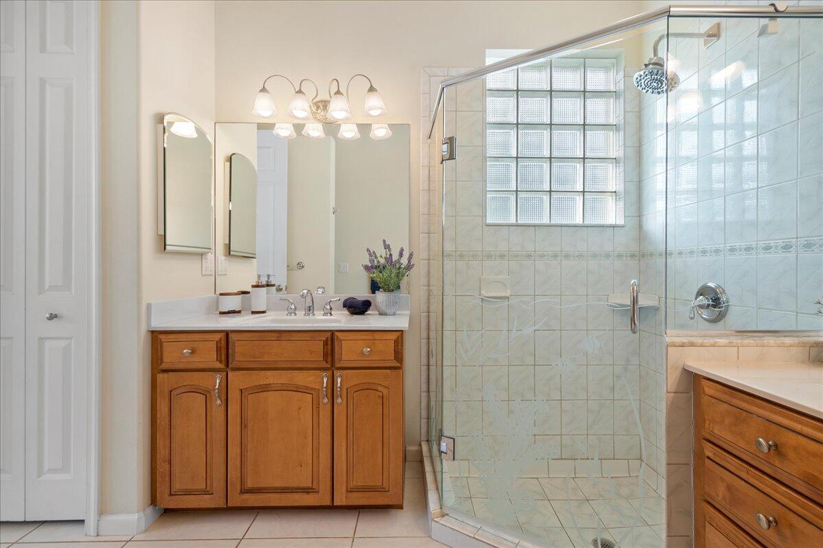 72 Waterway Road Jupiter, FL 33469 - Photo 20 of 57 a bathroom with a double vanity sink mirror and shower