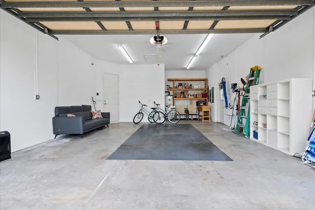 a swimming pool with outdoor seating and yard