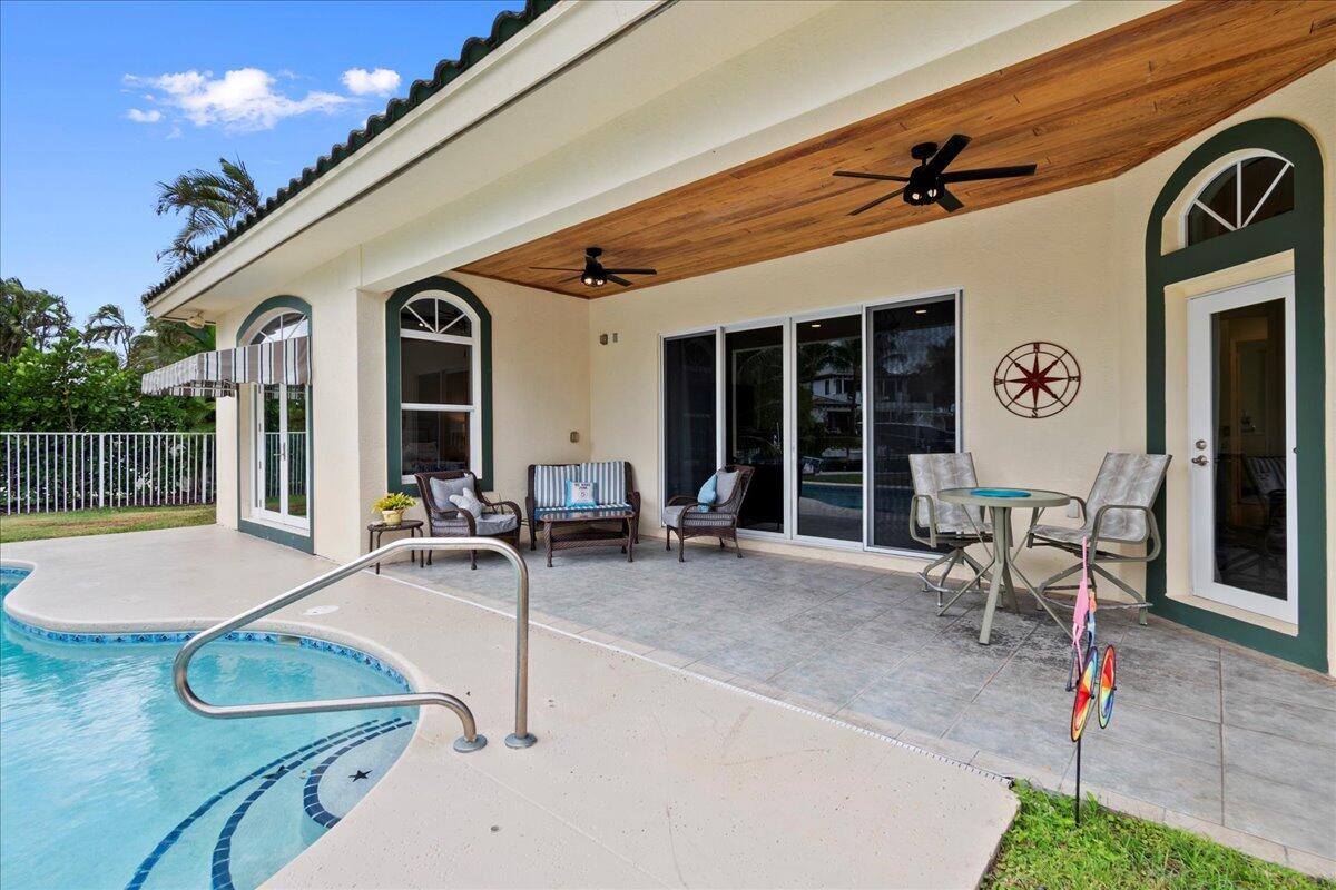 72 Waterway Road Jupiter, FL 33469 - Photo 31 of 57 a view of a house with patio outdoor seating