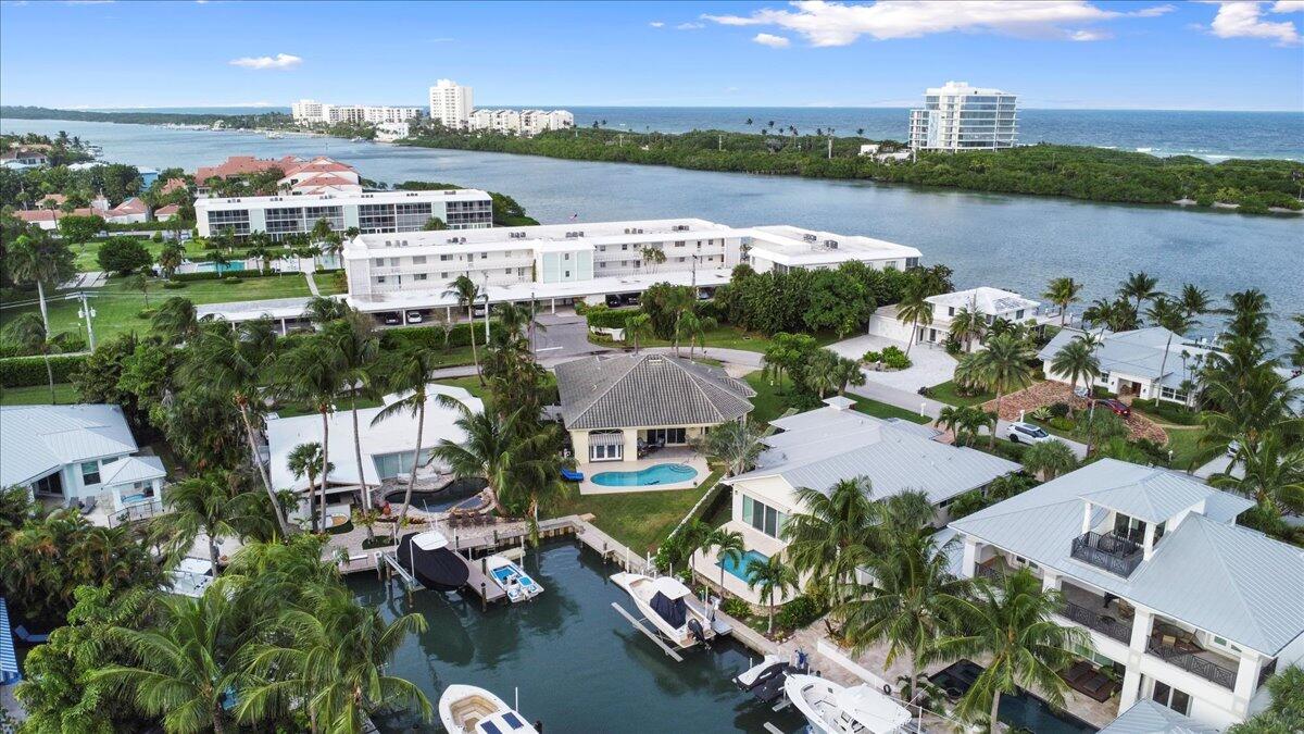 72 Waterway Road Jupiter, FL 33469 - Photo 36 of 57 an aerial view of a city with lots of residential buildings lake and ocean view