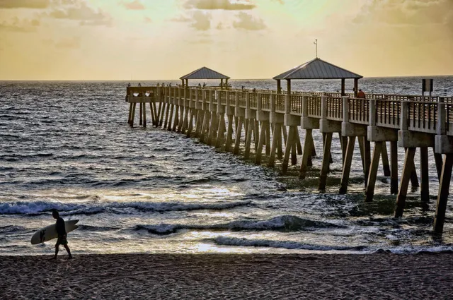 a swimming pool with trees in the background