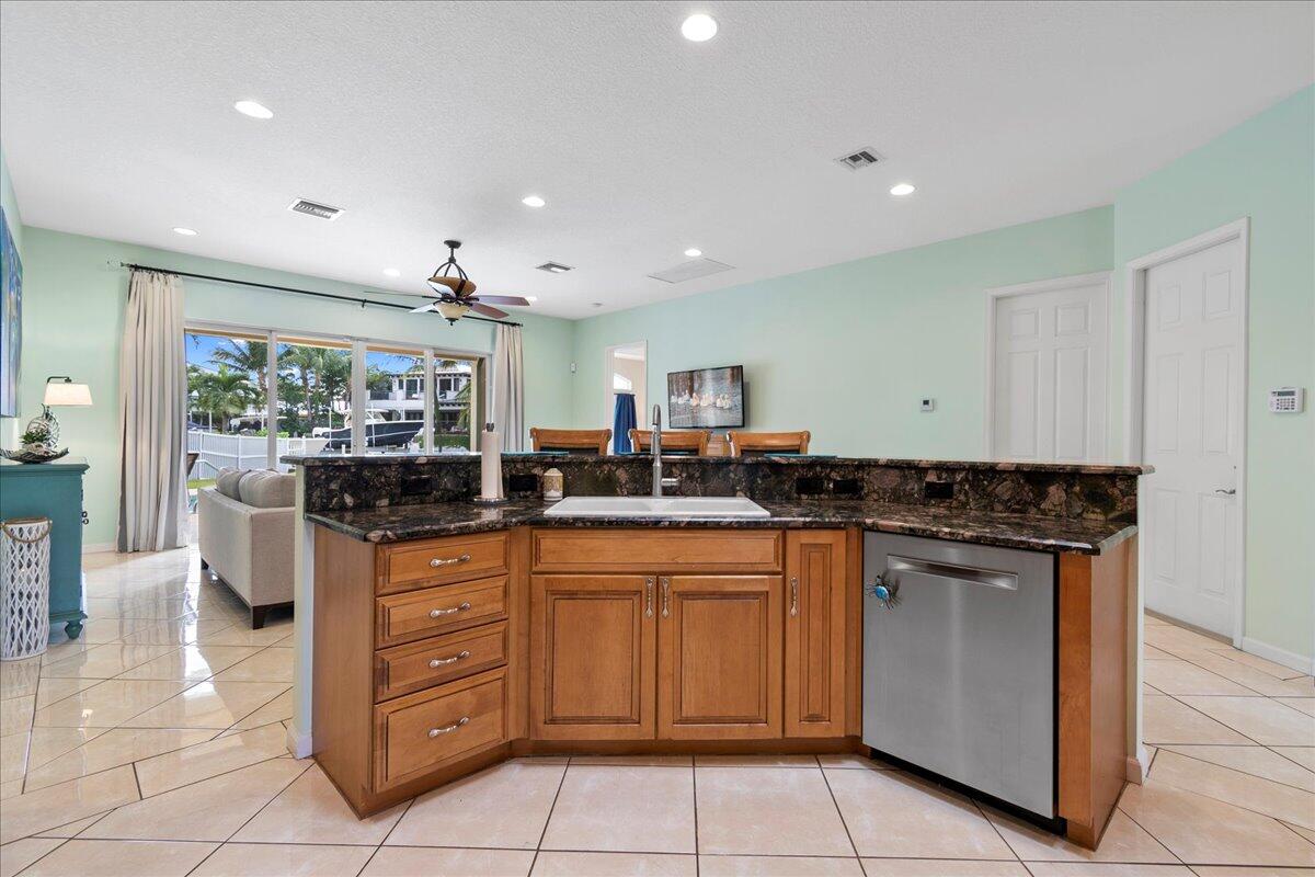 72 Waterway Road Jupiter, FL 33469 - Photo 7 of 57 a kitchen with a sink and cabinets