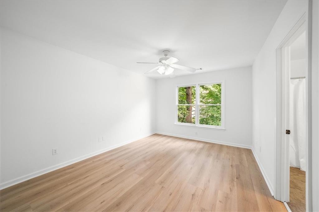 1710 Rising Mist Lane Cumming, GA 30041 - Photo 61 of 111 wooden floor in an empty room with a window