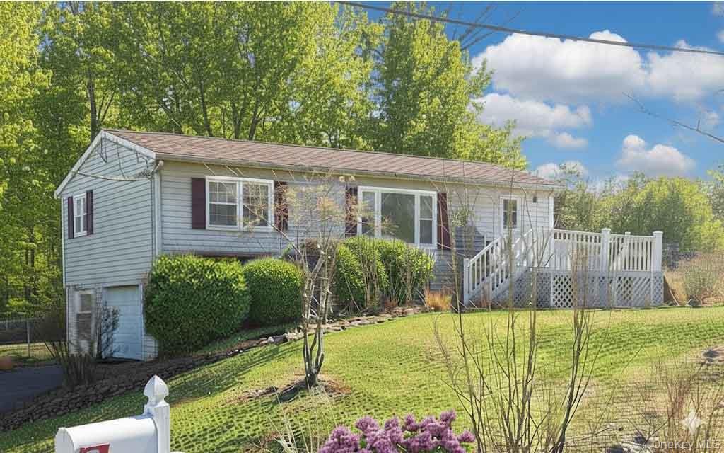 9 Merriewold Lane South Monroe, NY 10950 - Photo 2 of 14 View of front of house with an attached garage, a deck, and a front lawn