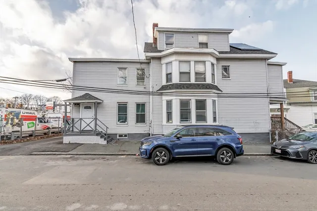 a car parked in front of a building
