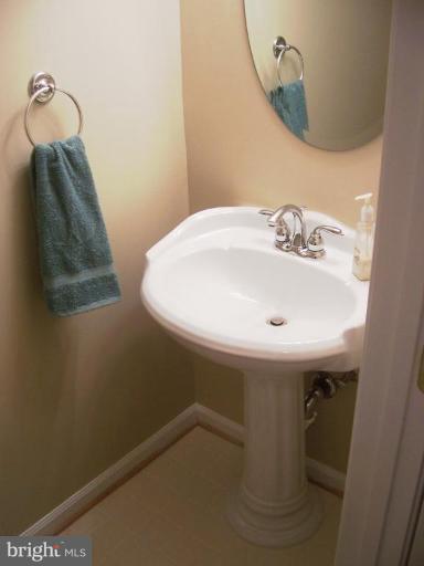 2936 Jermantown Road, Unit 10 Oakton, VA 22124 - Photo 5 of 7 a bathroom with a sink and mirror