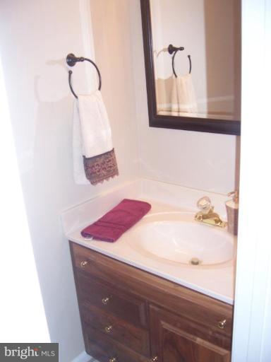2936 Jermantown Road, Unit 10 Oakton, VA 22124 - Photo 6 of 7 a bathroom with a sink and a mirror