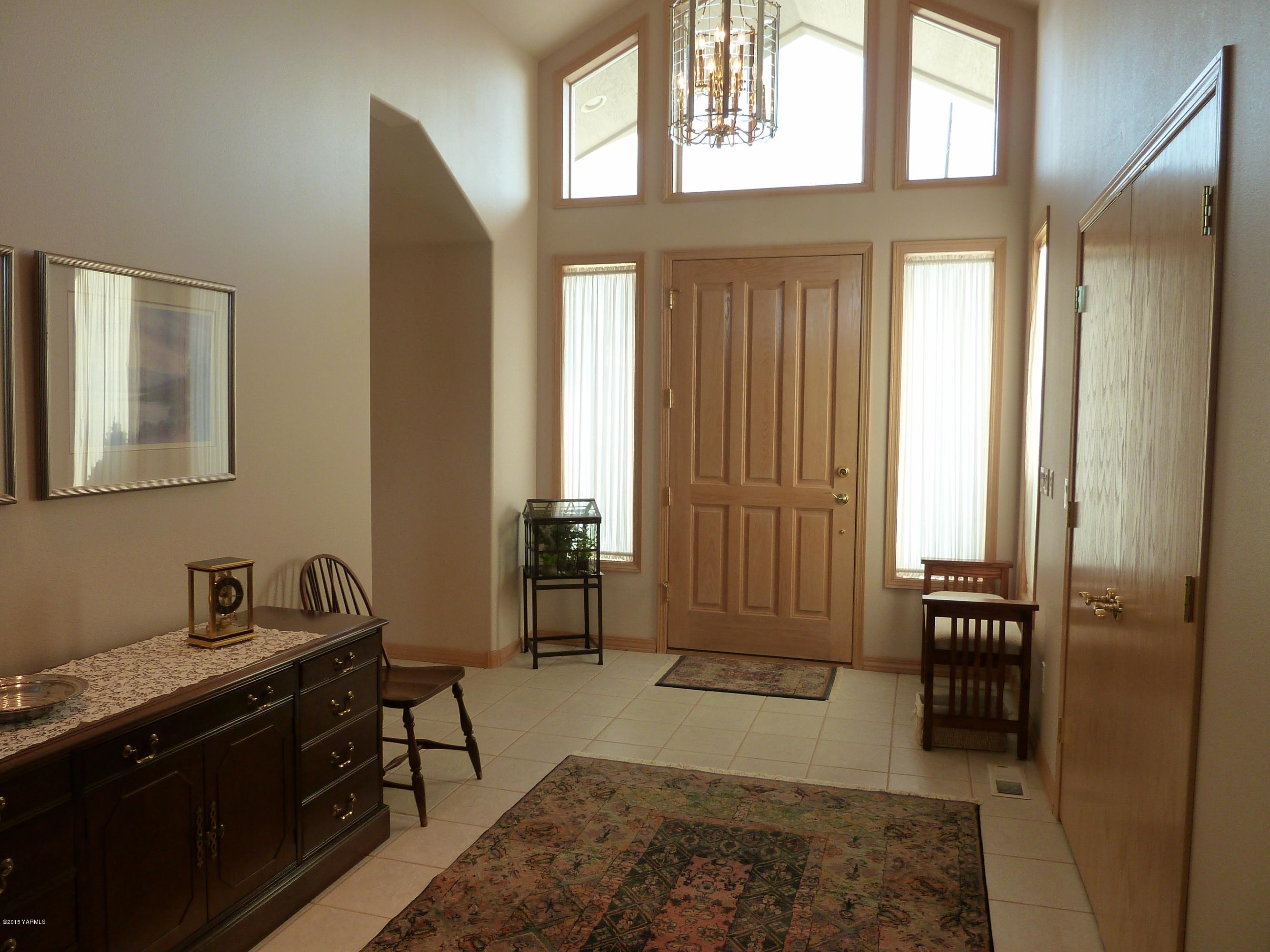 14000 Marble Road Yakima, WA 98908 - Photo 3 of 22 a bedroom with a bed and a dresser next to a window