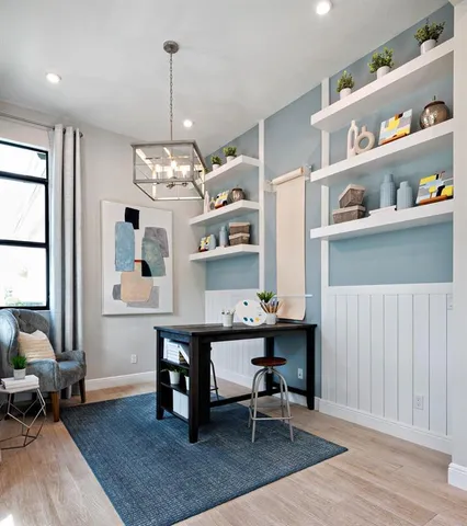 a view of a dining room with furniture and wooden floor