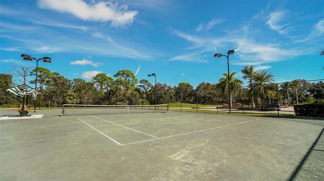 a view of an outdoor space and tennis court