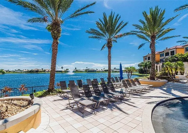 a view of a swimming pool with an outdoor seating