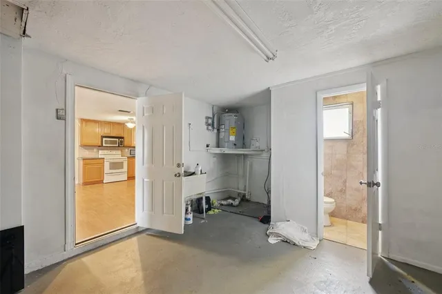 a view of room with cabinet and mirrors