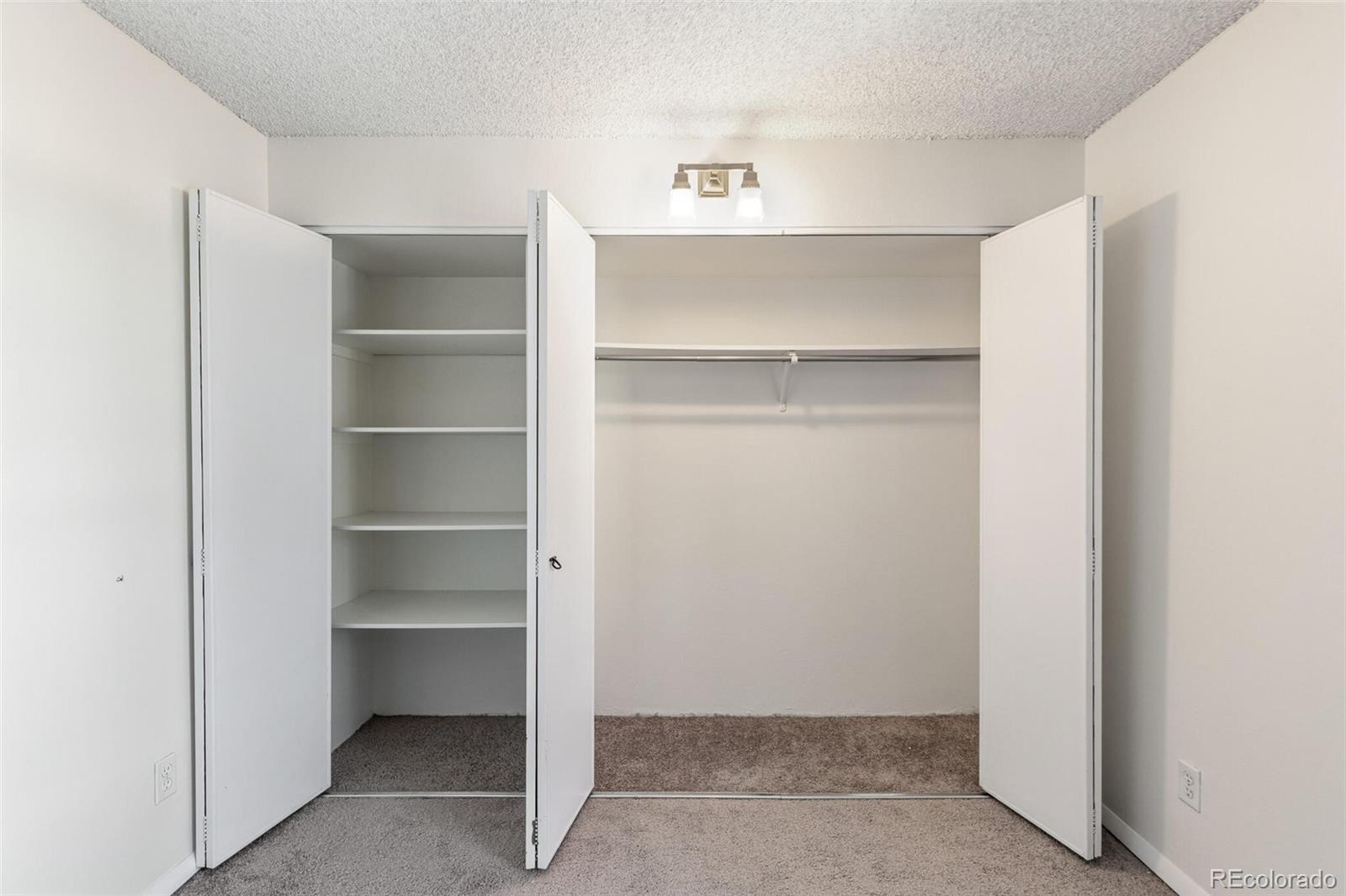2 Adams Street, Unit 910 Denver, CO 80206 - Photo 12 of 15 a view of an empty walk in closet