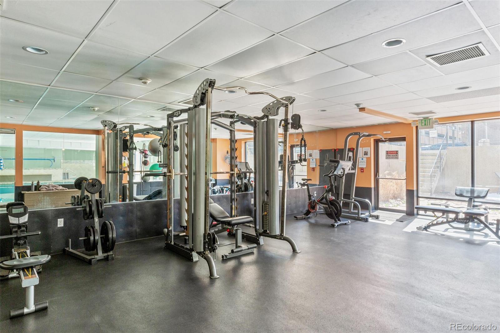 2 Adams Street, Unit 910 Denver, CO 80206 - Photo 14 of 15 a view of a room with gym equipment