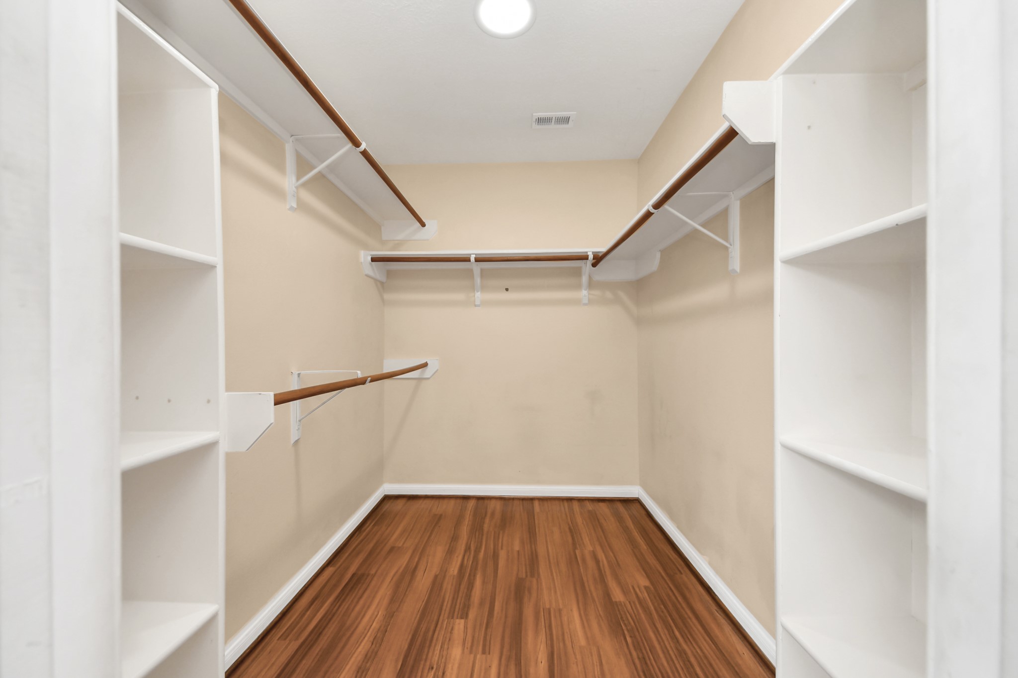 28707 Stapleford Street Spring, TX 77386 - Photo 20 of 38 a view of walk in closet with wooden floor