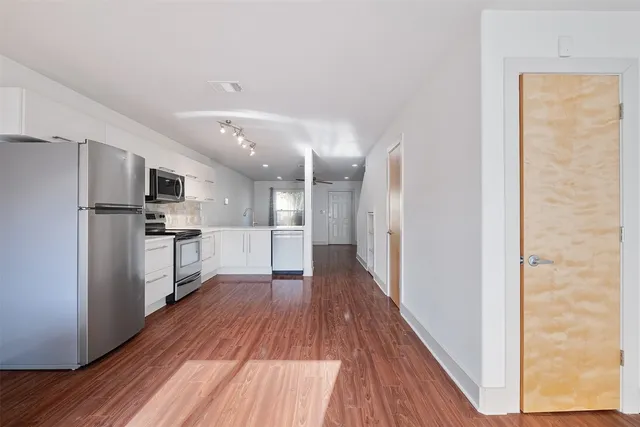 a view of a kitchen with electric appliances