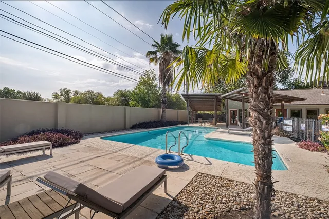 a view of a backyard with a patio