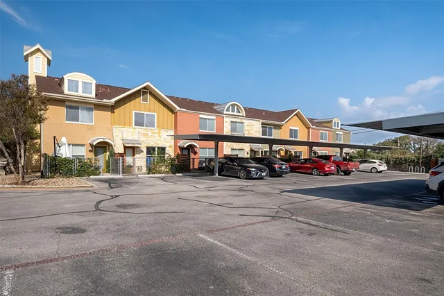 a view of multiple houses with a street