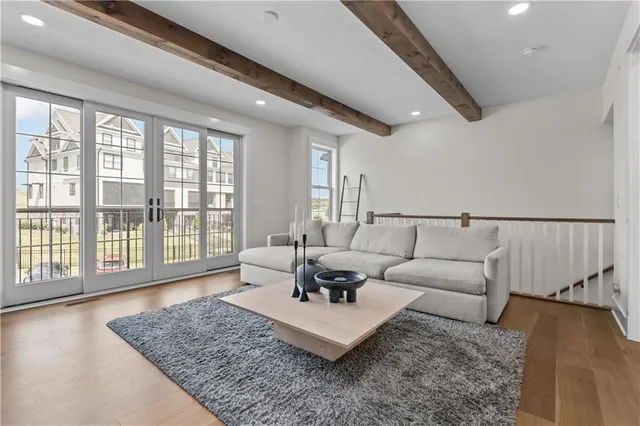 a living room with furniture and a rug