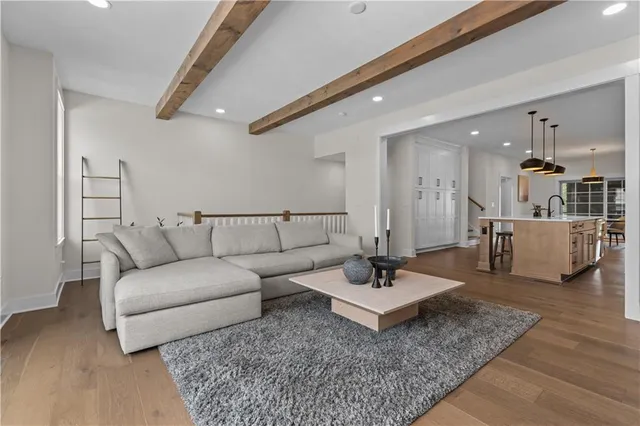 a living room with furniture and a rug