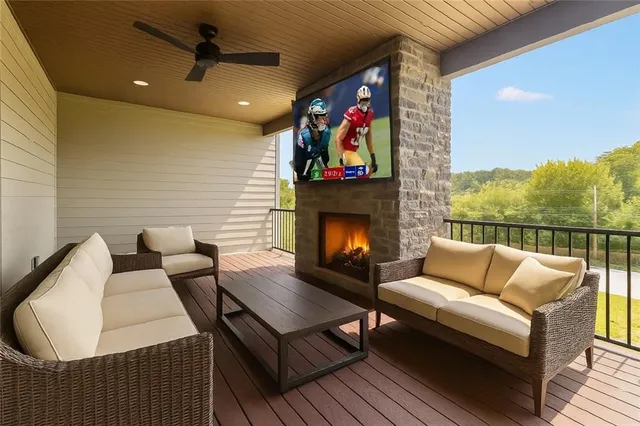 a outdoor living space with furniture and a fireplace
