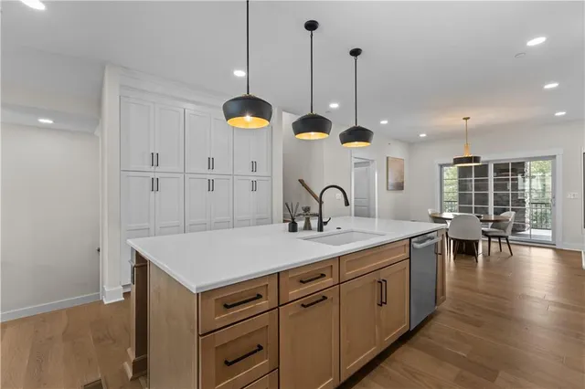 a view of a kitchen counter space with wooden floor