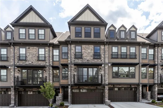a front view of a houses on the street