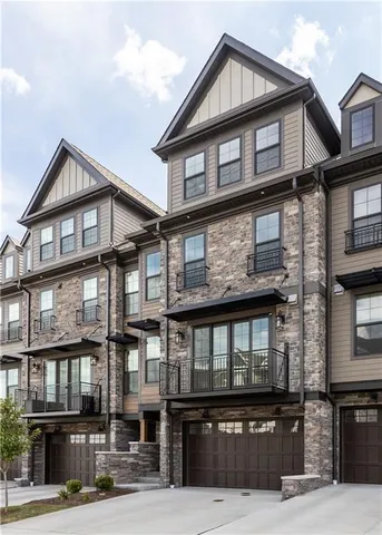 a front view of a building with many windows